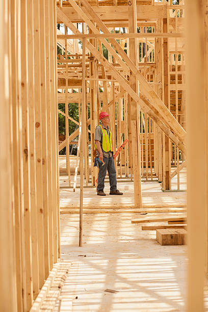 istock Construction worker busy working at job site. Framed building. 531324832