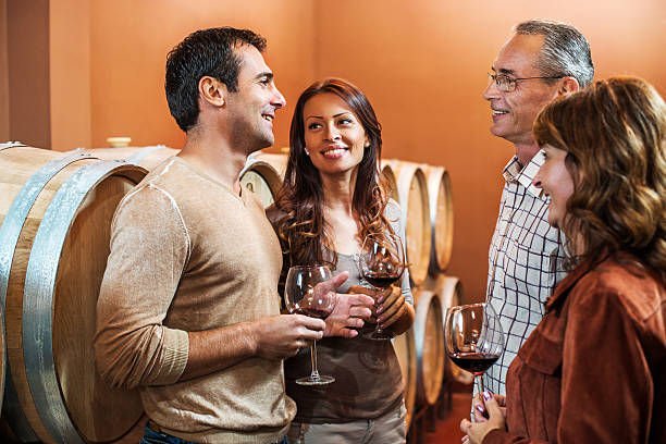 istock Happy people communicating in a wine cask. 531327423
