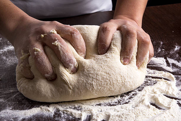 istock Making dough by female hands at bakery 531327584