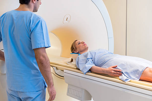 istock Female patient about receive an MRI Scan. 531328011