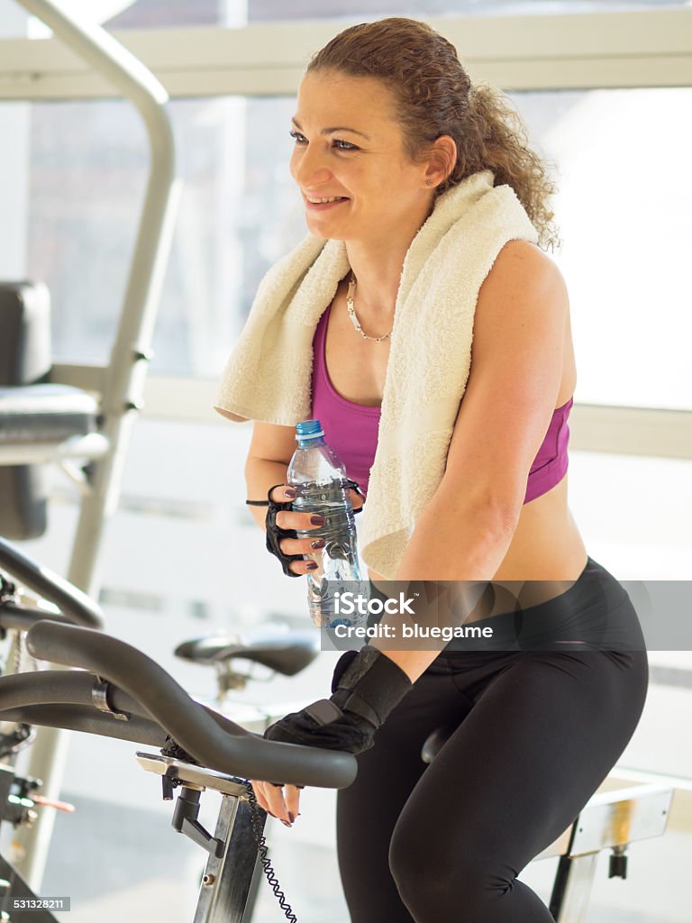 Fittness in Gym Young woman under training in Gym 2015 Stock Photo