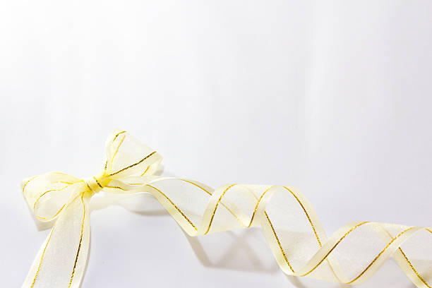 istock Gold ribbon with bow on white background 531330017