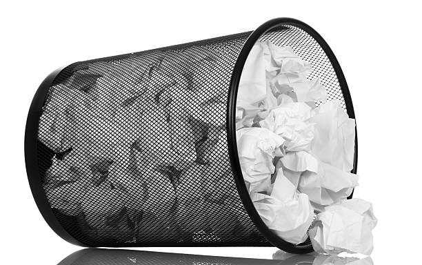 istock Frustrate metal bucket with paper waste isolated on white 531330652
