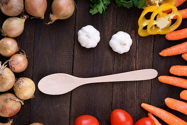 istock Vegetables and wood cooking spoon 531331289