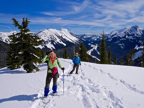 istock Two Women Snowshoeing in Mountains. 531331360