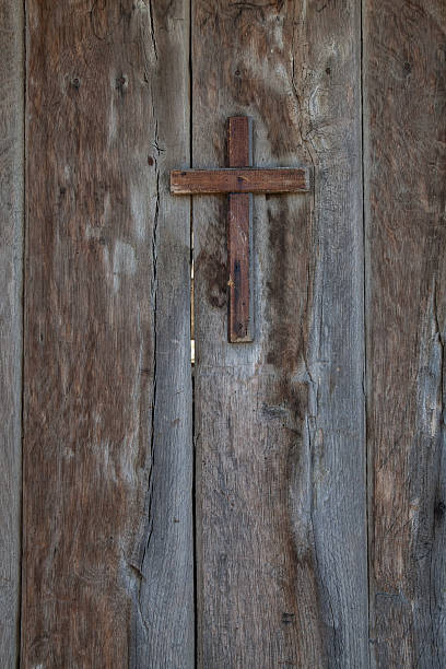 Aged door with a cross