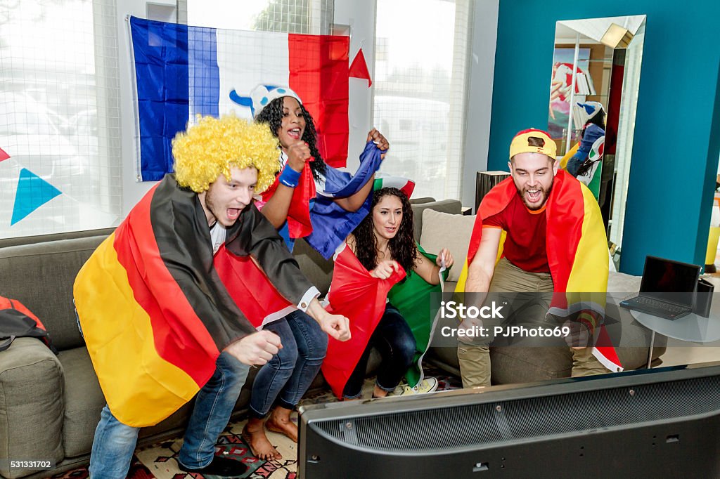 Group of supporters watching television Soccer Stock Photo