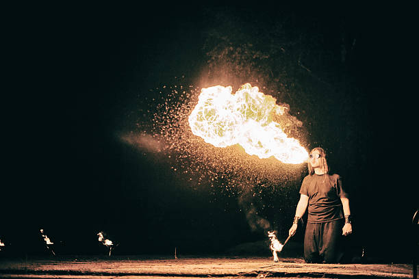 istock active European guy carries out tricks for fire show night 531333181