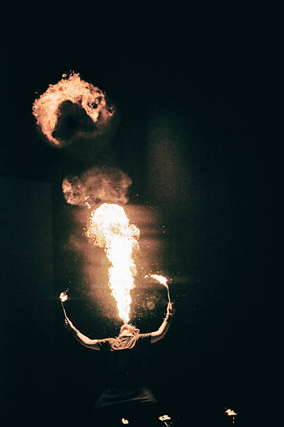 istock active European guy carries out tricks for fire show night 531333199