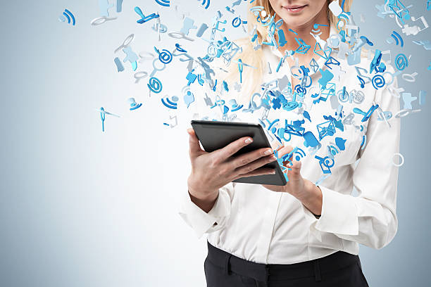 istock businesswoman holding  touch pad 531334575