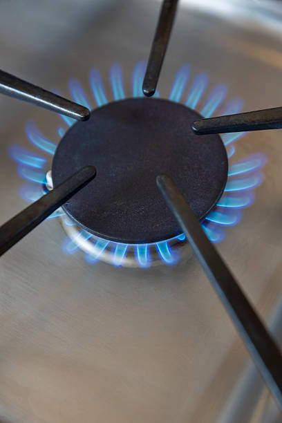 istock Blue flames from a gas stove burner vertical. 531344669