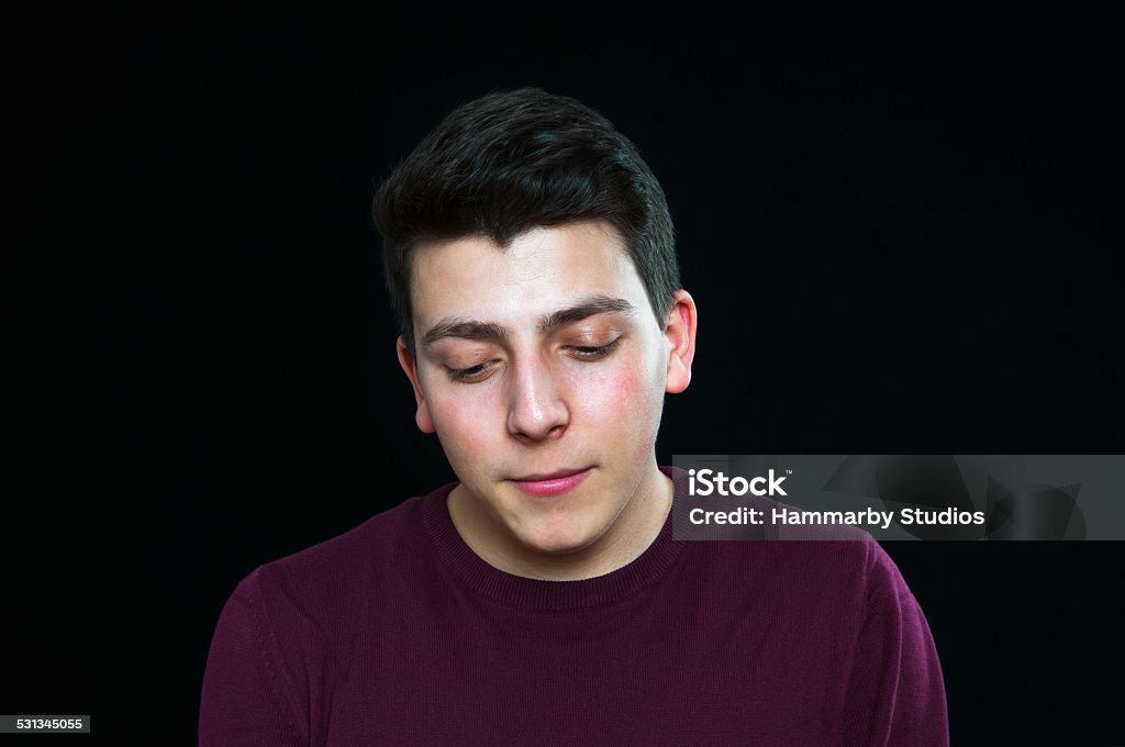 Sadness young man Portrait of a sadness young man,studio shot 2015 Stock Photo