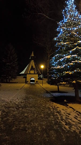 istock Christmas tree next to gothic church 531346253