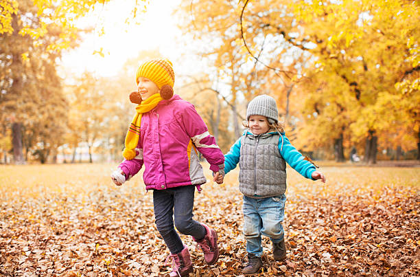 istock Children running in the park in autumn. 531347805