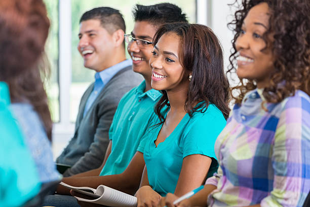 istock Diverse college students listening to professor or speaker in auditorium 531349639