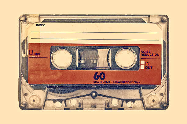 Retro styled image of an old compact cassette Retro styled image of an old compact cassette with empty label audio cassette photos stock pictures, royalty-free photos & images