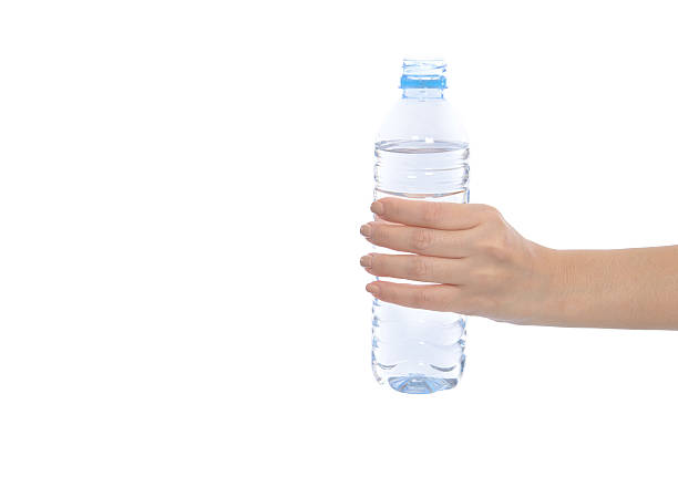 istock Hand hold bottle of drinking water on a white background 531357471