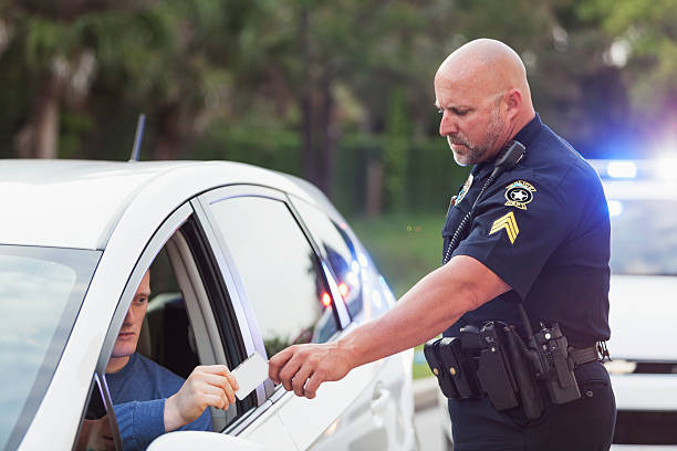 istock Driver pulled over by police, giving ID to officer 531357547