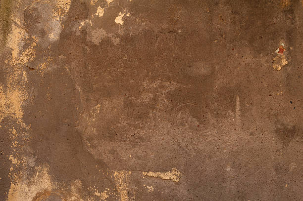 istock Texture of old wall covered with yellow stucco 531358731
