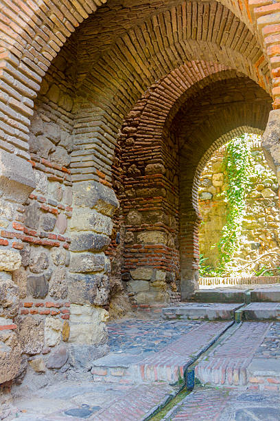 istock Ancient brick passageway door in the famous La Alcazaba 531358947