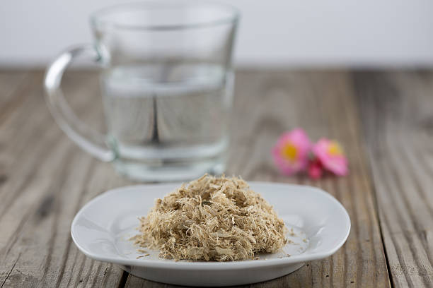 Slippery elm with a cup of water