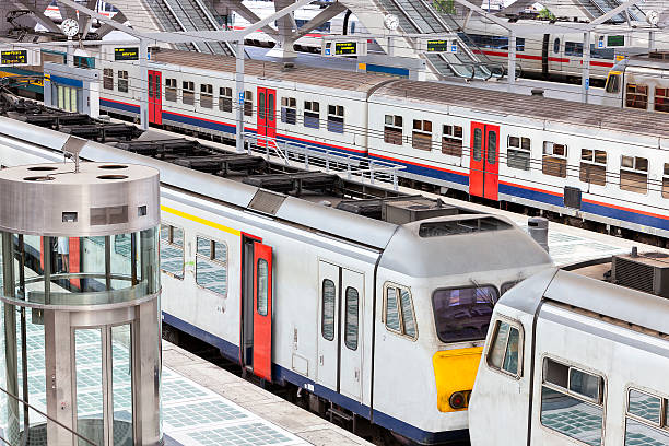 istock Trains on Platform in Modern Railway Station 531360293