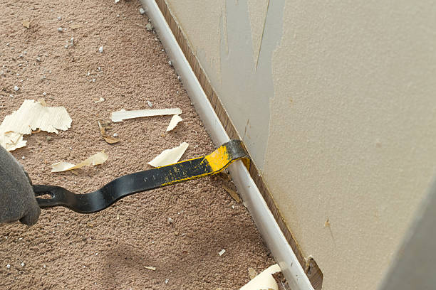 Removing Baseboard stock photo