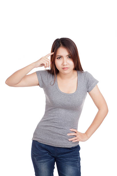 istock Young Asian woman point at her head 531362753