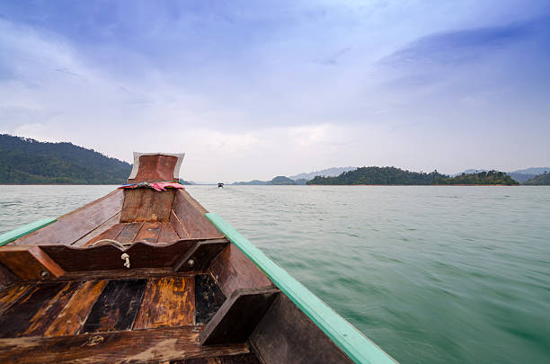 Beautiful mountains and natural attractions on long tail boat in Ratchaprapha Dam at Khao Sok National Park, Surat Thani Province, Thailand.