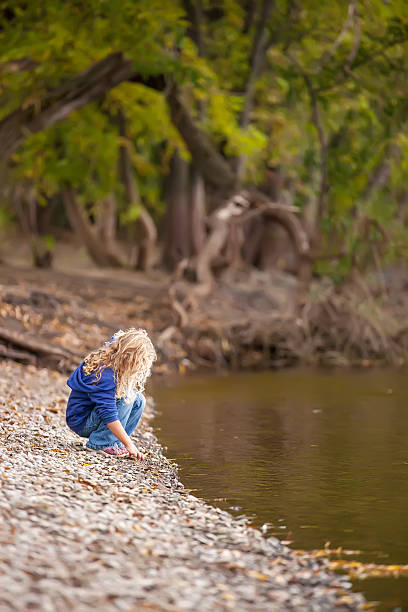 istock Girl on Riverbank 531372367