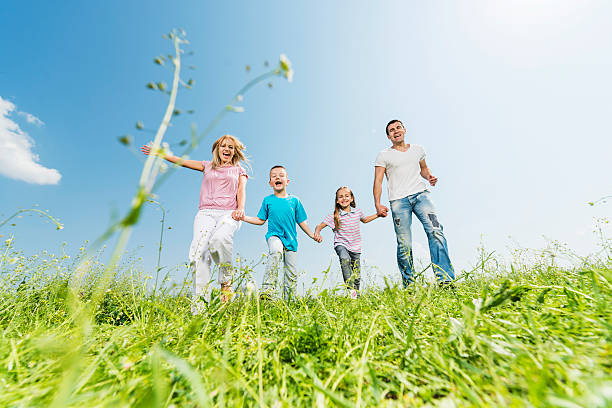 istock Family running on meadow. 531372839