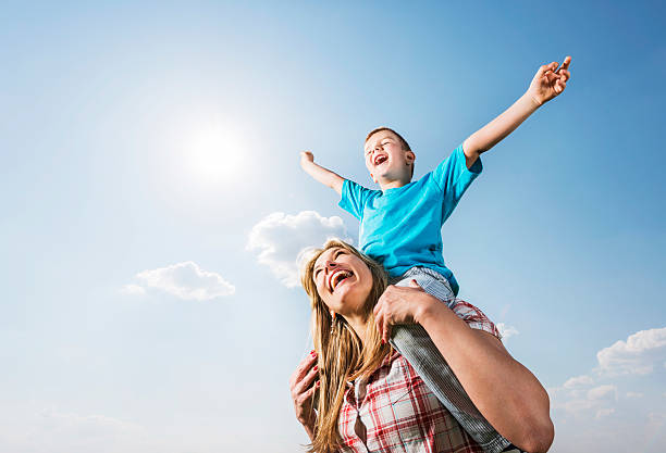 istock Playful mother and son against the sky. 531372845