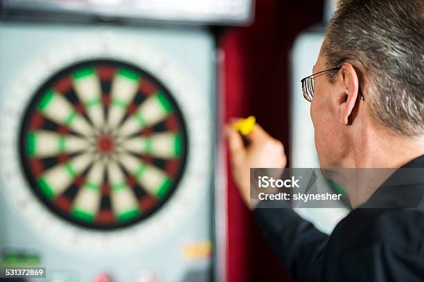 Man Playing Darts Stock Photo - Download Image Now - Darts, Dart, Playing