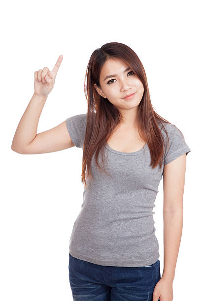 istock Young Asian woman smile and point up 531373395
