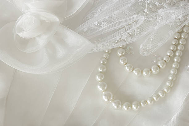 istock Pearl necklace on lace background. 531374051
