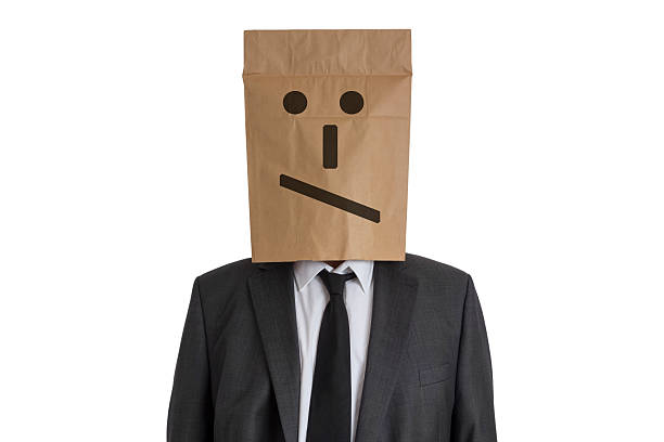 istock Man with Paper Bag with smiley on his head 531383617