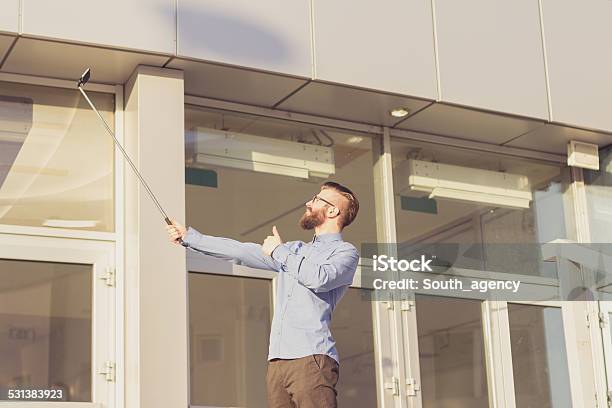 Young Businessman Having Fun In Front Of Office Building Stock Photo - Download Image Now