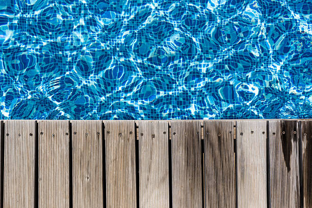 istock Swimming pool and wooden deck  for backgrounds 531385143
