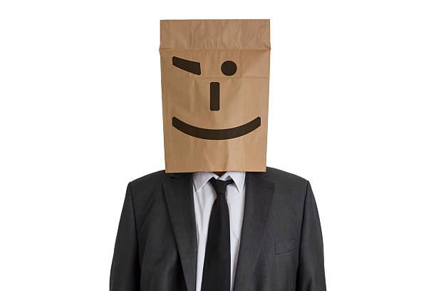 istock Man with Paper Bag with smiley on his head 531385215