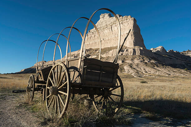 Scotts Bluff National Monument Scotts Bluff National Monument is located in western Nebraska.   Eagle Rock which was used as a landmark to the early pioneers on there way west. Mitchell pass is where the Oregon Trail crosses between Eagle Rock and Sentinel Rock. This Conestoga wagon is an example of the transportation that the early pioneers used on the journey west. eagle rock stock pictures, royalty-free photos & images