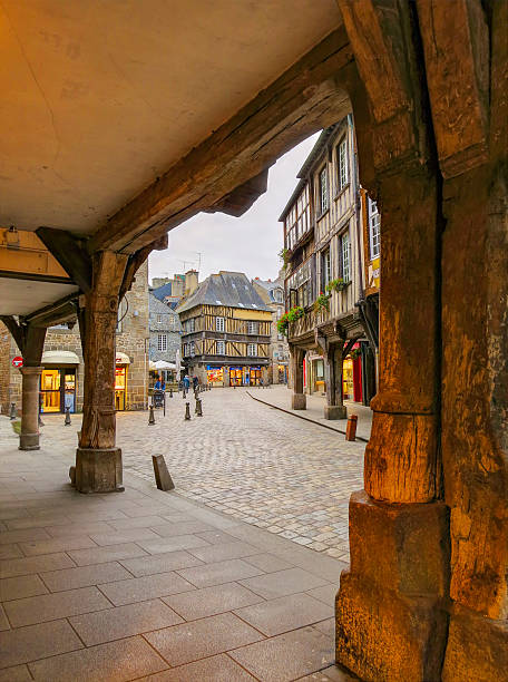 Old wooden pillars and center of Dinan, France stock photo