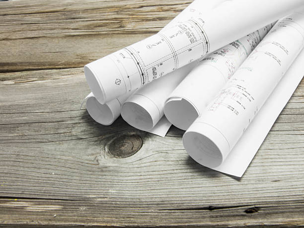 istock Architectural blueprint of office building on wood table 531387177