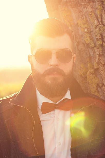 istock Hipster man portrait outdoors. Man is looking at camera 531387253