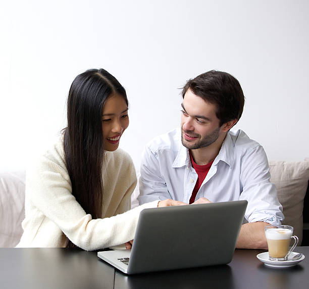istock Happy couple looking at laptop 531387327