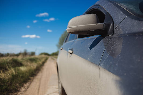 istock car side view in dust and blured summer field on 531394426