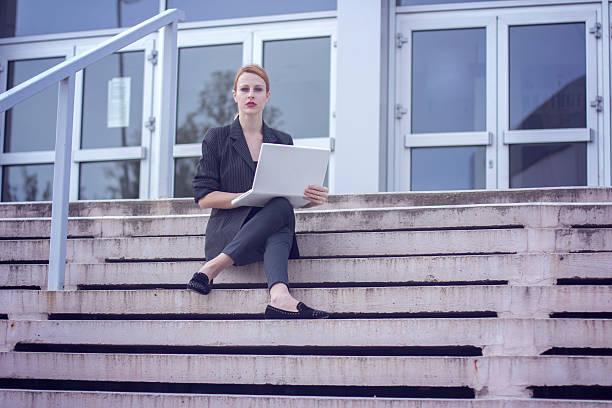 istock Blonde girl using laptop 531396074