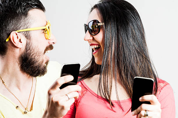 istock thrilled couple taking mobile photographs and selfies 531396394