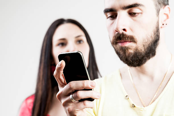 istock woman disappointed about his man on his mobile 531396618