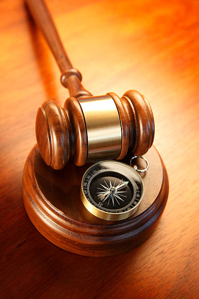istock Compass and gavel on sound block 531398449