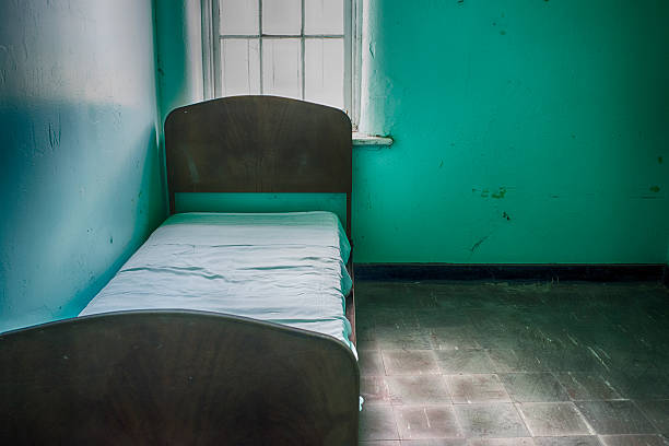istock Bed in a deserted mental hospital 531398485